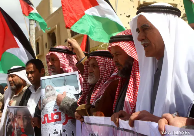 Palestinians attend a rally in front of the Rafah border crossing with Egypt on March 17, 2012, during a sit-in Rafah demanding Egypt provide the Gaza Strip with electricity and diesel. The Palestinian energy authority i...