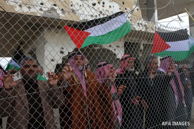 Palestinians attend a rally in front of the Rafah border crossing with Egypt on March 17, 2012, during a sit-in Rafah demanding Egypt provide the Gaza Strip with electricity and diesel. The Palestinian energy authority i...
