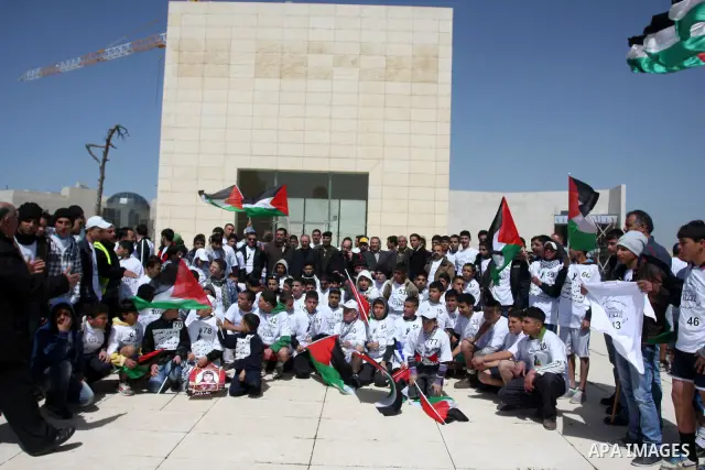 Palestinian youths participating in the Marathon "Jerusalem is the eternal capital of Palestine", which was launched in front of the tomb of President easer President Arafat in Ramallah, West Bank, March 19, 2012 ". Phot...