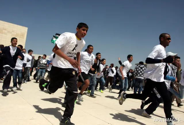 Palestinian youths participating in the Marathon "Jerusalem is the eternal capital of Palestine", which was launched in front of the tomb of President easer President Arafat in Ramallah, West Bank, March 19, 2012 ". Phot...