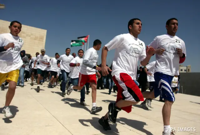 Palestinian youths participating in the Marathon "Jerusalem is the eternal capital of Palestine", which was launched in front of the tomb of President easer President Arafat in Ramallah, West Bank, March 19, 2012 ". Phot...