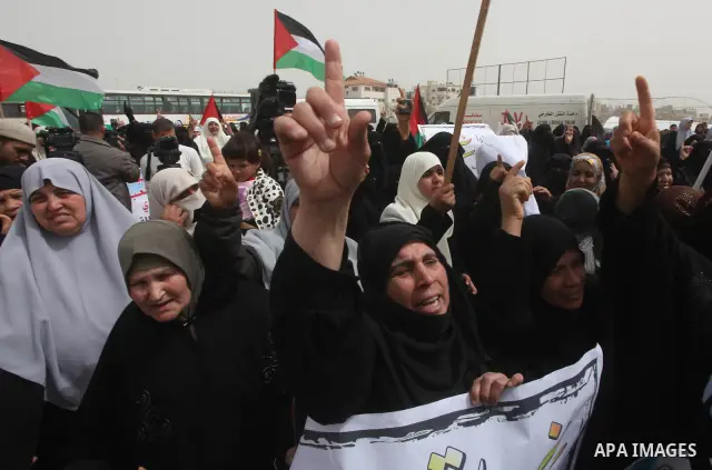 Palestinian women take part in a Hamas rally calling on Egyptian authorities to provide the Gaza Strip with electricity and fuel near the Rafah Border crossing, in the southern Gaza Strip, 20 March 2012. Gazans are repor...