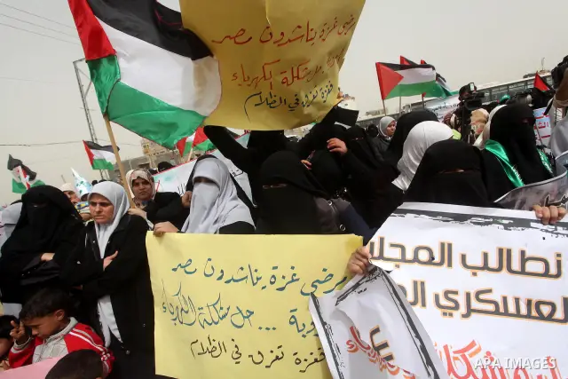 Palestinian women take part in a Hamas rally calling on Egyptian authorities to provide the Gaza Strip with electricity and fuel near the Rafah Border crossing, in the southern Gaza Strip, 20 March 2012. Gazans are repor...