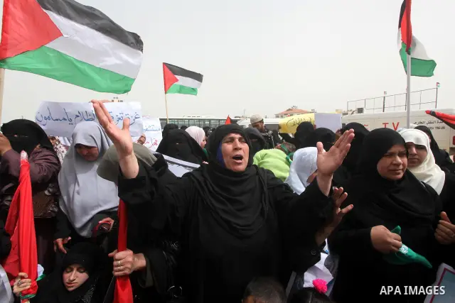 Palestinian women take part in a Hamas rally calling on Egyptian authorities to provide the Gaza Strip with electricity and fuel near the Rafah Border crossing, in the southern Gaza Strip, 20 March 2012. Gazans are repor...