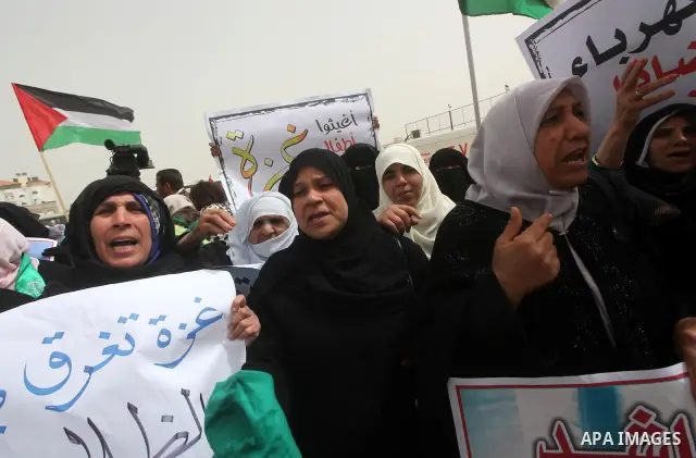 Palestinian women take part in a Hamas rally calling on Egyptian authorities to provide the Gaza Strip with electricity and fuel near the Rafah Border crossing, in the southern Gaza Strip, 20 March 2012. Gazans are repor...
