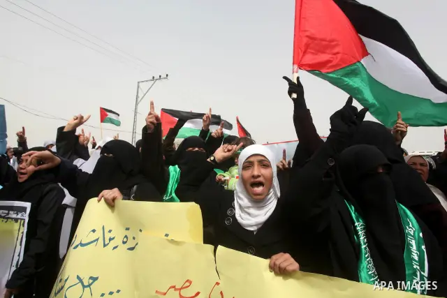 Palestinian women take part in a Hamas rally calling on Egyptian authorities to provide the Gaza Strip with electricity and fuel near the Rafah Border crossing, in the southern Gaza Strip, 20 March 2012. Gazans are repor...