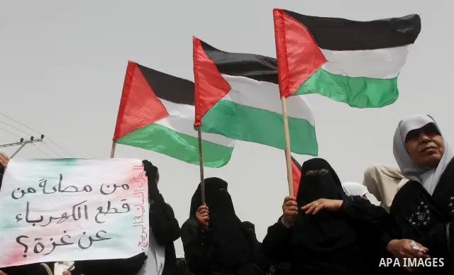 Palestinian women take part in a Hamas rally calling on Egyptian authorities to provide the Gaza Strip with electricity and fuel near the Rafah Border crossing, in the southern Gaza Strip, 20 March 2012. Gazans are repor...