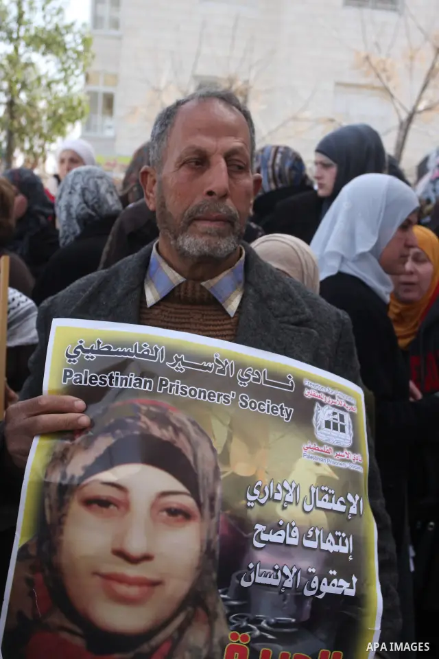 Palestinian women hold portraits of Islamic Jihad supporter Hana Shalabi, a female Palestinian prisoner jailed in Israel who has been on hunger strike for 35 days, during a rally in solidarity with Palestinian prisoners...