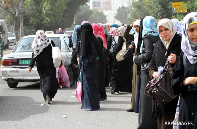 palestinians students wait a taxis in the street after the fuel shortage in Gaza Strip on 20 march 2012. Gaza's top political leader blamed Egypt earlier this month for causing a power crisis that has triggered lengthy b...
