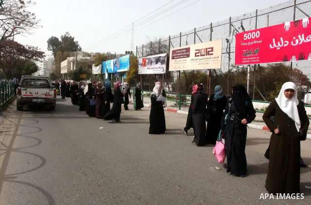 palestinians students wait a taxis in the street after the fuel shortage in Gaza Strip on 20 march 2012. Gaza's top political leader blamed Egypt earlier this month for causing a power crisis that has triggered lengthy b...