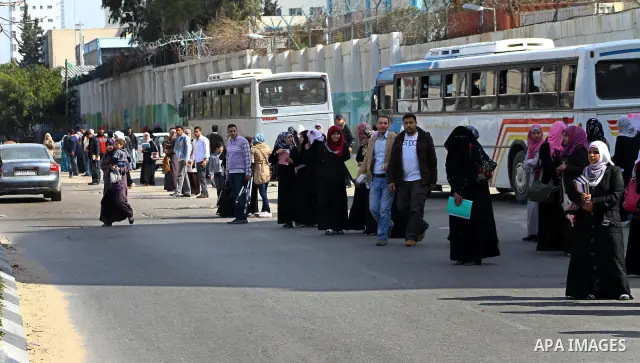 palestinians students wait a taxis in the street after the fuel shortage in Gaza Strip on 21 march 2012. Gaza's top political leader blamed Egypt earlier this month for causing a power crisis that has triggered lengthy b...