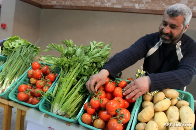 Palestinians attend exhibition for agricultural products in Gaza City on Mar. 22, 2012. to support the Palestinian national products. Photo by Mohammed Asad