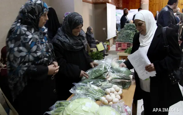 Palestinians attend exhibition for agricultural products in Gaza City on Mar. 22, 2012. to support the Palestinian national products. Photo by Mohammed Asad
