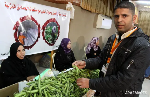 Palestinians attend exhibition for agricultural products in Gaza City on Mar. 22, 2012. to support the Palestinian national products. Photo by Mohammed Asad