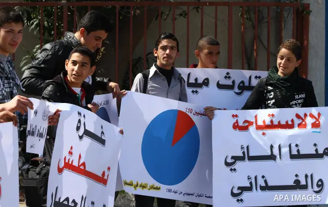 Palestinian students protest in front of UNESCO against the problem of water and electricity in Gaza City on Mar. 22, 2012. Photo by Ashraf Amra