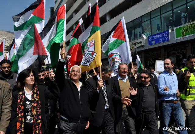 Demonstrators from the Palestinian factions participating in demonstration to end the division and are demanding a national unity in the West Bank city of Nablus, Mar. 22, 2012 .Photo by Nedal Shtieh.