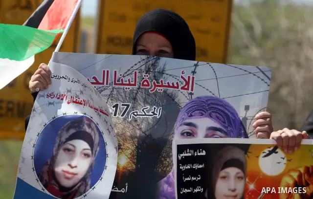 Palestinian demonstrators during a protest supporting Palestinian prisoner Hana Shalabi, outside Ofer prison near the West Bank city of Ramallah March 22, 2012. The deteriorating health of Shalabi, the Palestinian prison...