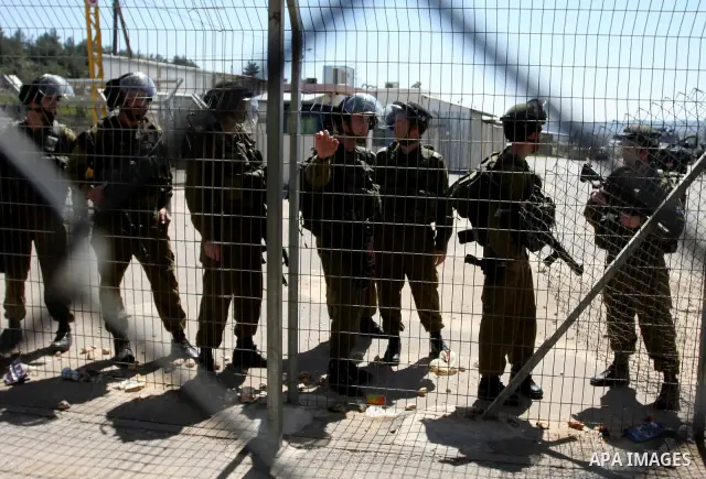 Palestinian demonstrators during a protest supporting Palestinian prisoner Hana Shalabi, outside Ofer prison near the West Bank city of Ramallah March 22, 2012. The deteriorating health of Shalabi, the Palestinian prison...