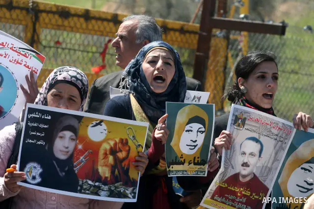 Palestinian demonstrators during a protest supporting Palestinian prisoner Hana Shalabi, outside Ofer prison near the West Bank city of Ramallah March 22, 2012. The deteriorating health of Shalabi, the Palestinian prison...