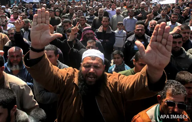 Palestinians take part in a rally calling on Egyptian authorities to supply the Gaza Strip with fuel and electricity in Khan Younis on the southern Gaza Strip March 23, 2012. Israel allowed nine fuel tankers to cross int...