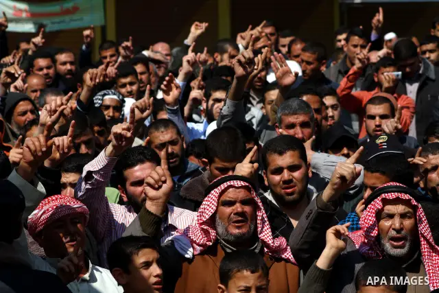 Palestinians take part in a rally calling on Egyptian authorities to supply the Gaza Strip with fuel and electricity in Khan Younis on the southern Gaza Strip March 23, 2012. Israel allowed nine fuel tankers to cross int...