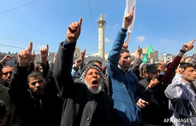 Palestinians take part in a rally calling on Egyptian authorities to supply the Gaza Strip with fuel and electricity in Khan Younis on the southern Gaza Strip March 23, 2012. Israel allowed nine fuel tankers to cross int...