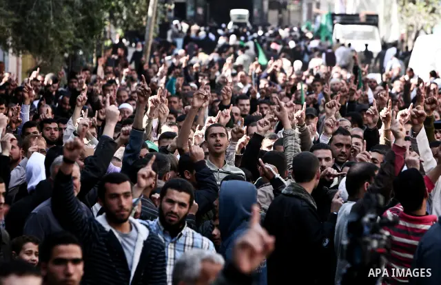 Palestinians take part in a rally calling on Egyptian authorities to supply the Gaza Strip with fuel and electricity in Gaza City March 23, 2012. Israel allowed nine fuel tankers to cross into the Gaza Strip on Friday to...