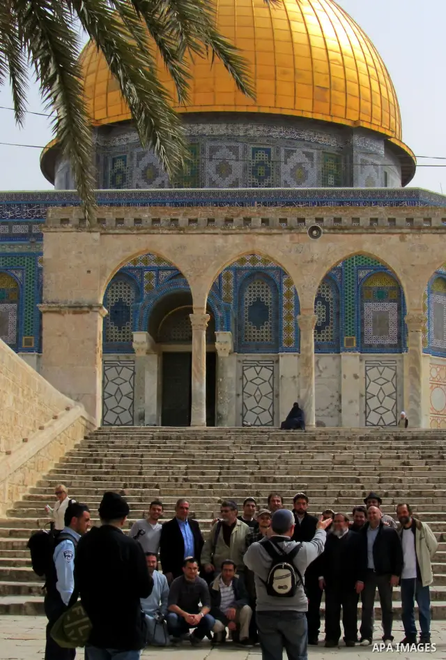 Jewish settler look to the dome of the rock at Al-Aqsa mosque in the old city of Jerusalem on March. 25, 2012. Photo by Mahfouz Abu Turk