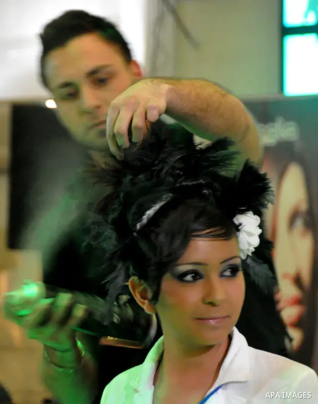 Israeli Arab models line up on stage during a beauty pageant and hair styling contest in the West Bank city of Tulkarem, Monday, March 26, 2012. Over 100 Palestinians, Israeli Arabs and Golan residents took part in the p...