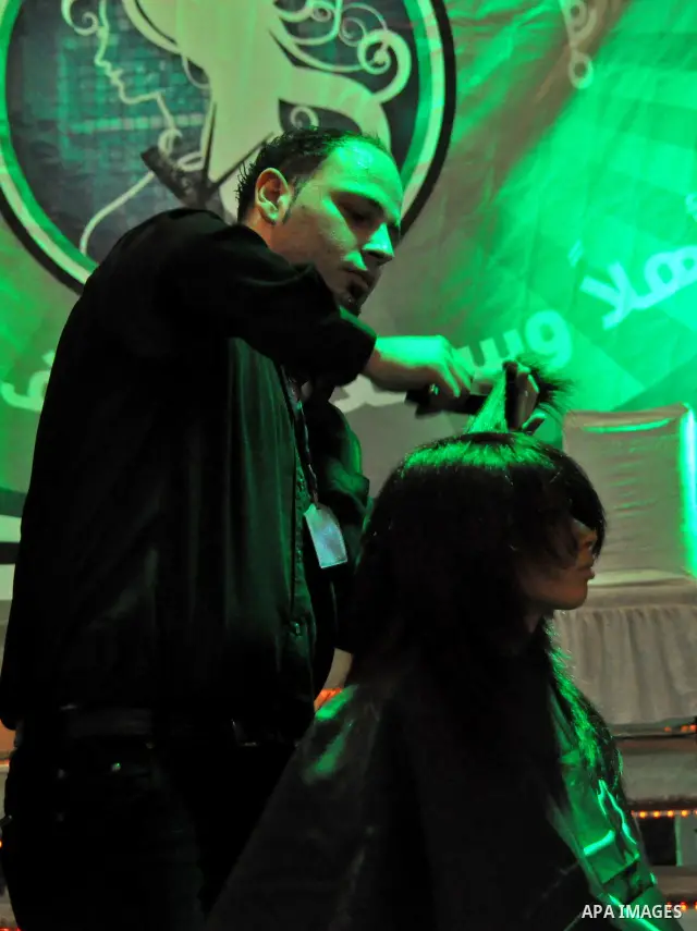 Israeli Arab models line up on stage during a beauty pageant and hair styling contest in the West Bank city of Tulkarem, Monday, March 26, 2012. Over 100 Palestinians, Israeli Arabs and Golan residents took part in the p...
