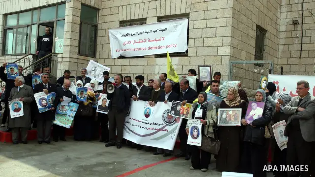 Palestinians hold portraits of Islamic Jihad supporter Hana Shalabi, a female Palestinian prisoner jailed in Israel who has been on hunger strike for 35 days, during a rally in solidarity with Palestinian prisoners in Is...