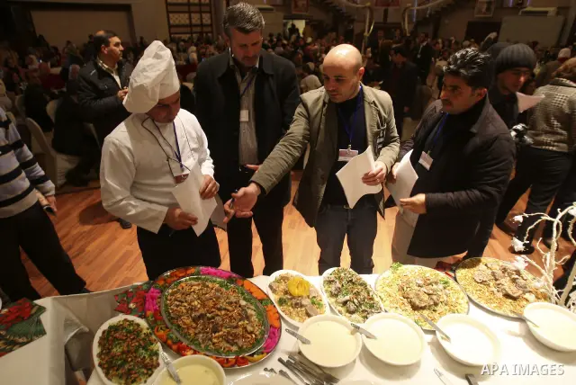 Palestinians take part during festival for the best cook in West Bank city of Nablus Tuesday, March 27, 2012. Photo by Wagdi Eshtayah