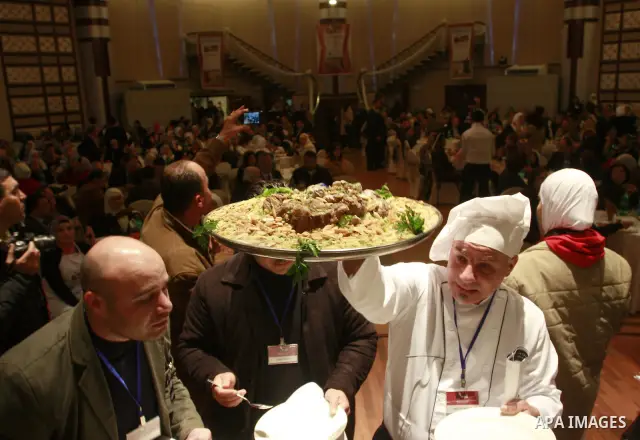 Palestinians take part during festival for the best cook in West Bank city of Nablus Tuesday, March 27, 2012. Photo by Wagdi Eshtayah