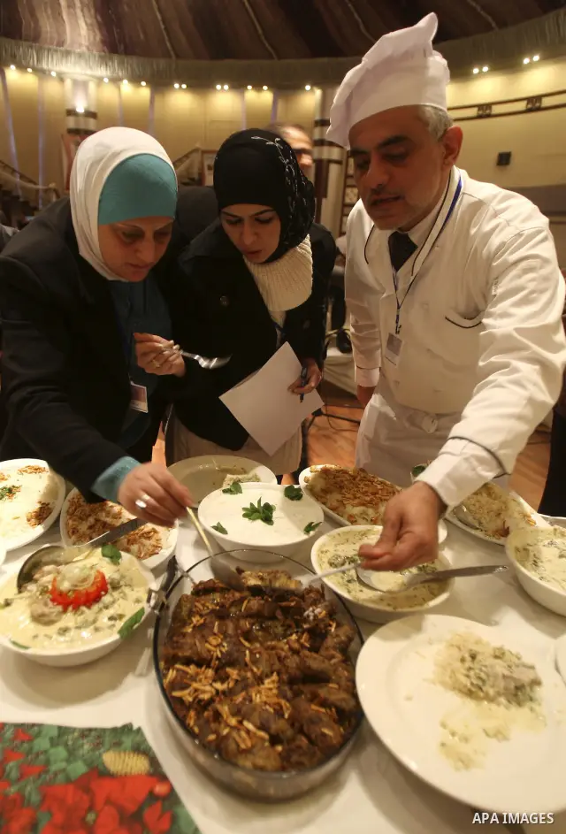 Palestinians take part during festival for the best cook in West Bank city of Nablus Tuesday, March 27, 2012. Photo by Wagdi Eshtayah