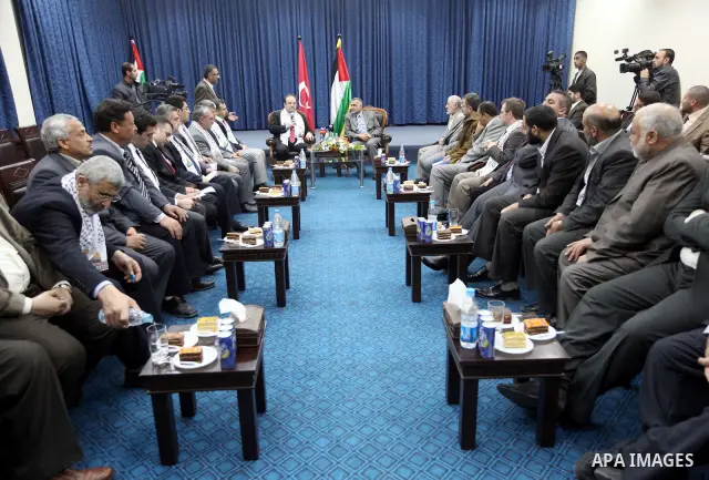 Palestinian Foreign Affairs Minister in Gaza Strip, Mohammed Awad receives President of the Teka Institution in Gaza City on Mar. 27,2012. Photo by Ahmed Shaat
