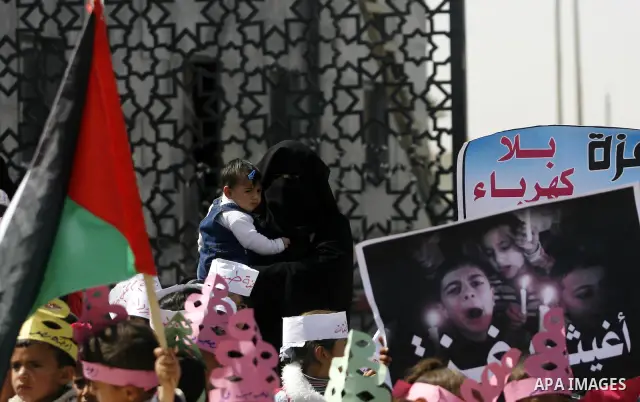 Palestinian children protest in front of the Rafah border crossing with Egypt in southern Gaza on Mar. 09, 2012. Protesters asked for Egypt to provide the Gaza Strip with electricity and diesel fuel. Gaza is experiencing...
