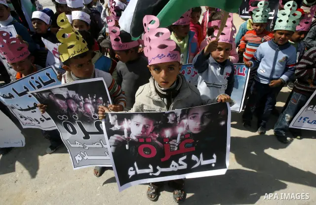 Palestinian children protest in front of the Rafah border crossing with Egypt in southern Gaza on Mar. 09, 2012. Protesters asked for Egypt to provide the Gaza Strip with electricity and diesel fuel. Gaza is experiencing...