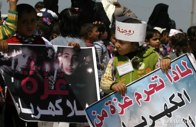 Palestinian children protest in front of the Rafah border crossing with Egypt in southern Gaza on Mar. 09, 2012. Protesters asked for Egypt to provide the Gaza Strip with electricity and diesel fuel. Gaza is experiencing...