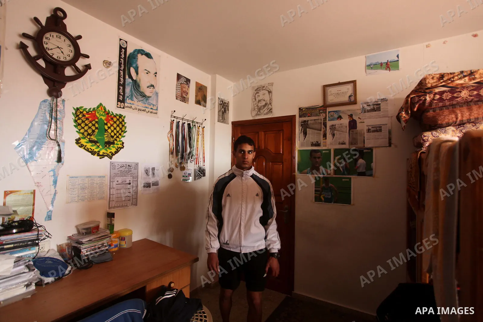 Palestinian runner Bahaa al-Farra, who has been selected to represent Palestine at the London Olympics in July - August 2012 during a break at his house in Gaza City on March 29, 2012. Farra will be one of a four-strong...