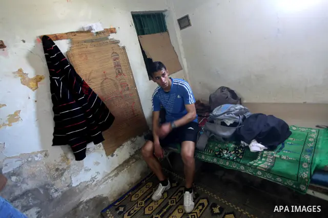 Palestinian runner Bahaa al-Farra, who has been selected to represent Palestine at the London Olympics in July - August 2012 during a break at his house in Gaza City on March 29, 2012. Farra will be one of a four-strong...