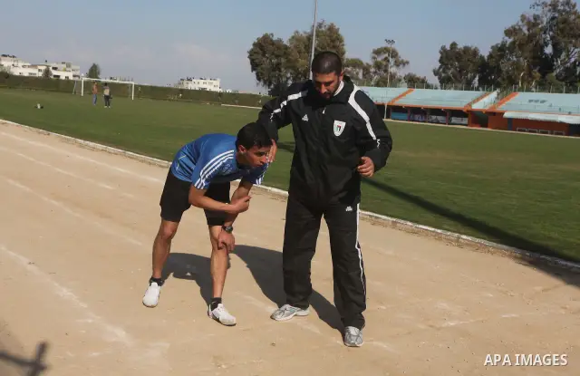 Palestinian runner Bahaa al-Farra, who has been selected to represent Palestine at the London Olympics in July - August 2012 during training at the al-Yarmouk soccer stadium in Gaza City on March 29, 2012. Farra will be...