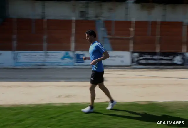 Palestinian runner Bahaa al-Farra, who has been selected to represent Palestine at the London Olympics in July - August 2012 during training at the al-Yarmouk soccer stadium in Gaza City on March 29, 2012. Farra will be...