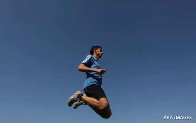 Palestinian runner Bahaa al-Farra, who has been selected to represent Palestine at the London Olympics in July - August 2012 during training at the al-Yarmouk soccer stadium in Gaza City on March 29, 2012. Farra will be...