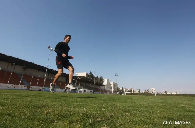 Palestinian runner Bahaa al-Farra, who has been selected to represent Palestine at the London Olympics in July - August 2012 during training at the al-Yarmouk soccer stadium in Gaza City on March 29, 2012. Farra will be...