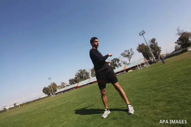 Palestinian runner Bahaa al-Farra, who has been selected to represent Palestine at the London Olympics in July - August 2012 during training at the al-Yarmouk soccer stadium in Gaza City on March 29, 2012. Farra will be...