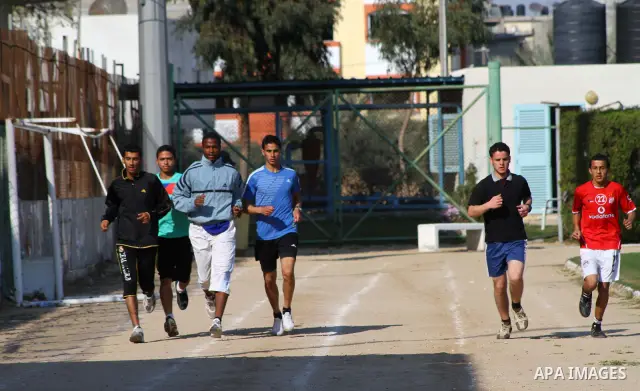 Palestinian runner Bahaa al-Farra, who has been selected to represent Palestine at the London Olympics in July - August 2012 during training at the al-Yarmouk soccer stadium in Gaza City on March 29, 2012. Farra will be...