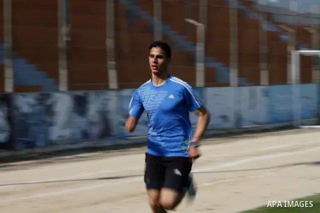 Palestinian runner Bahaa al-Farra, who has been selected to represent Palestine at the London Olympics in July - August 2012 during training at the al-Yarmouk soccer stadium in Gaza City on March 29, 2012. Farra will be...