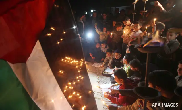 Palestinian children hold candles during a protest calling for power in Gaza City, on March 29, 2012. The Red Cross said on March, 29 it would ship emergency supplies of fuel to help alleviate the Gaza Strip's worsening...