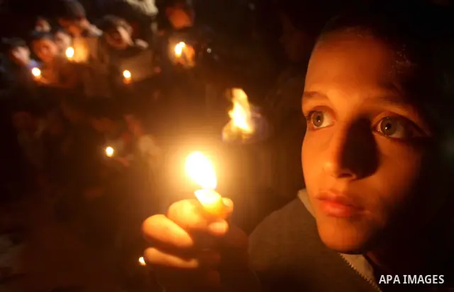 Palestinian children hold candles during a protest calling for power in Gaza City, on March 29, 2012. The Red Cross said on March, 29 it would ship emergency supplies of fuel to help alleviate the Gaza Strip's worsening...