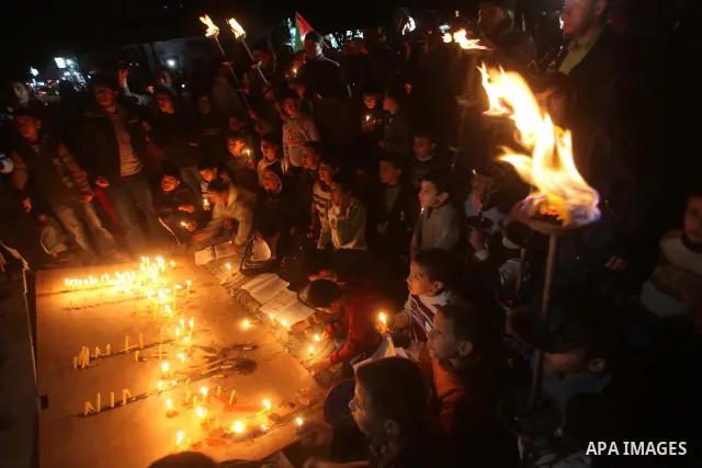 Palestinian children hold candles during a protest calling for power in Gaza City, on March 29, 2012. The Red Cross said on March, 29 it would ship emergency supplies of fuel to help alleviate the Gaza Strip's worsening...